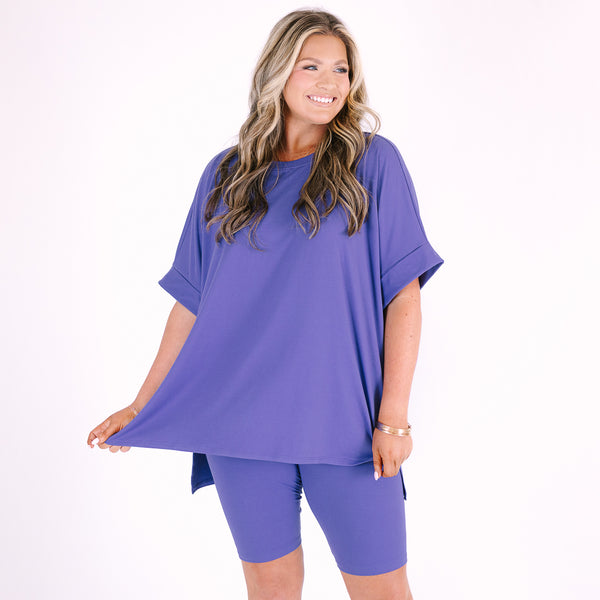 Plus Size marlin blue short set with a round neck high-low top and matching biker shorts.