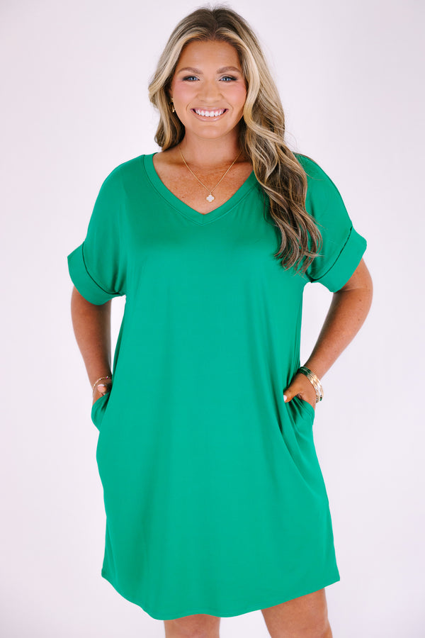 Plus Size kelly green v-neck dress with rolled short sleeves, a relaxed fit, and side pockets.