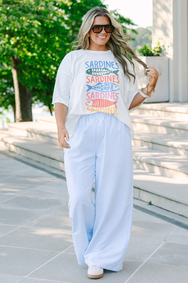 Plus size light blue and white vertical striped wide-leg pants with an elastic waistband and flowy fit.
