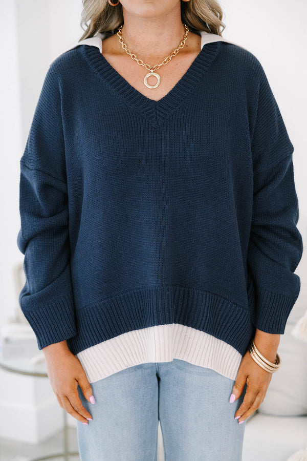 Plus size navy v-neck sweater with a relaxed, flowy fit and ribbed hem 