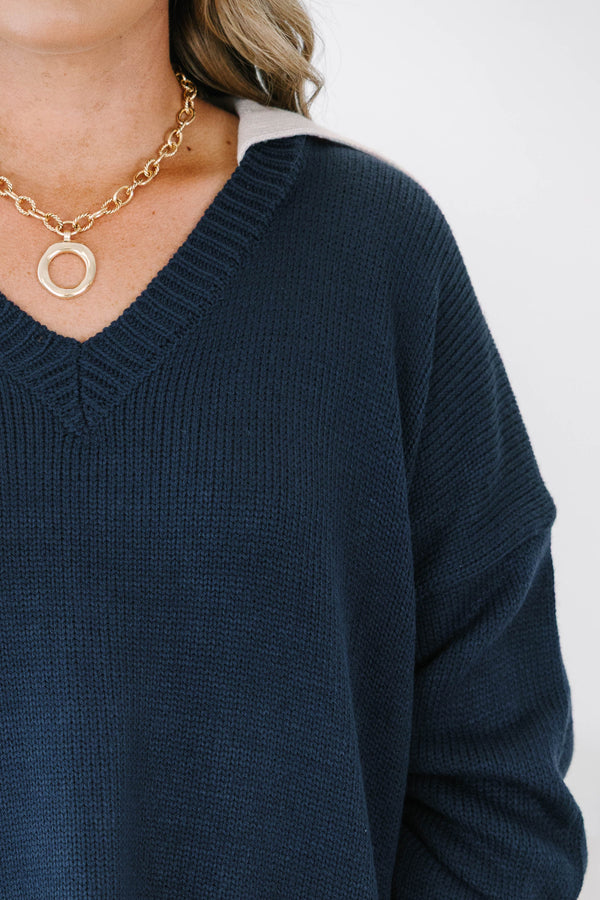 Plus size navy v-neck sweater with a relaxed, flowy fit and ribbed hem 