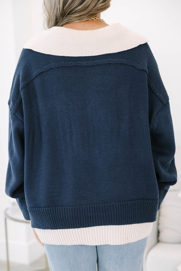 Plus size navy v-neck sweater with a relaxed, flowy fit and ribbed hem 