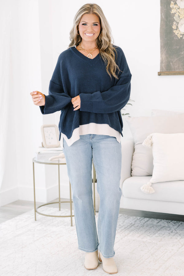 Plus size navy v-neck sweater with a relaxed, flowy fit and ribbed hem 
