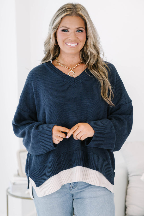Plus size navy v-neck sweater with a relaxed, flowy fit and ribbed hem 