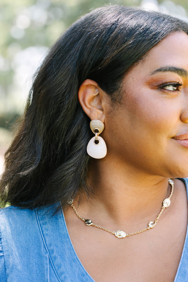Plus Size gold drop earrings with two-tier neutral stone pendants and a gold chain necklace.