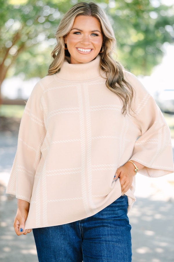 Plus Size taupe turtleneck sweater with a white windowpane plaid pattern and wide bell sleeves.