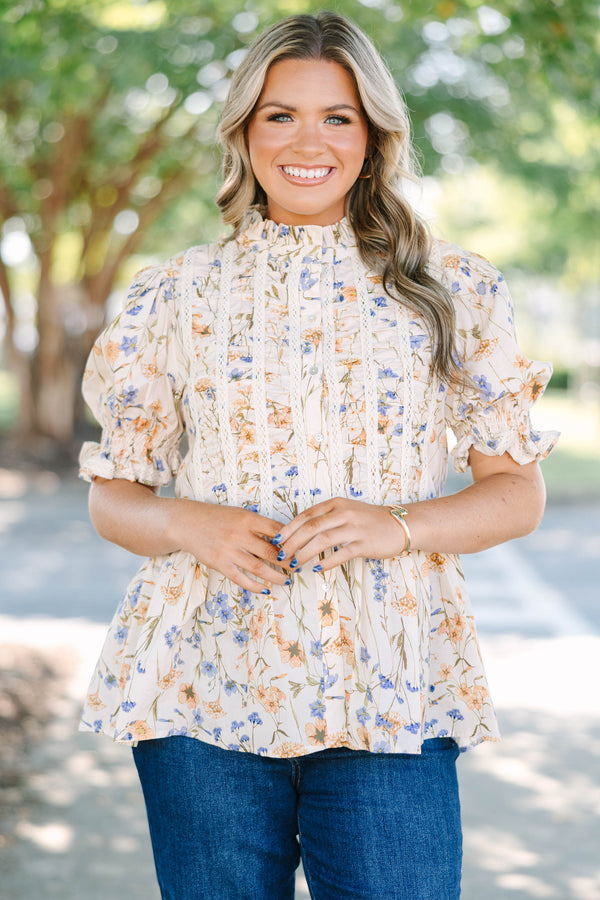 Plus Size cream floral top with puff sleeves, lace trim, and a high ruffled neckline.