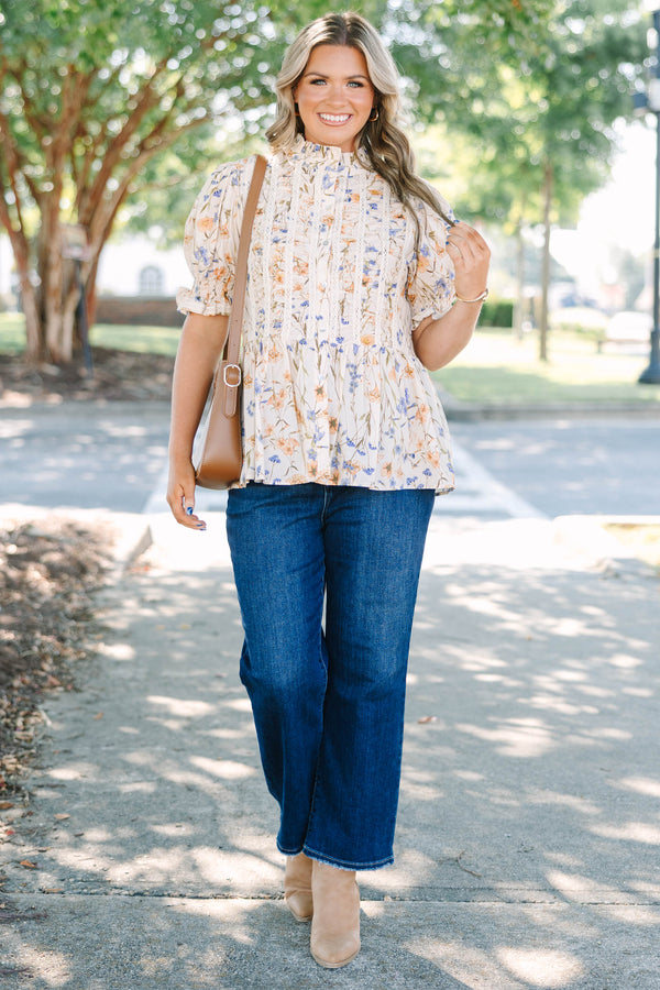 Plus Size cream floral top with puff sleeves, lace trim, and a high ruffled neckline.