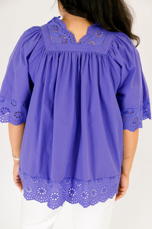 Chic Soul plus size clothing, blue flowy short sleeve top with eyelet detailing on the edges of the sleeves, bottom of top, and bordering v-neckline