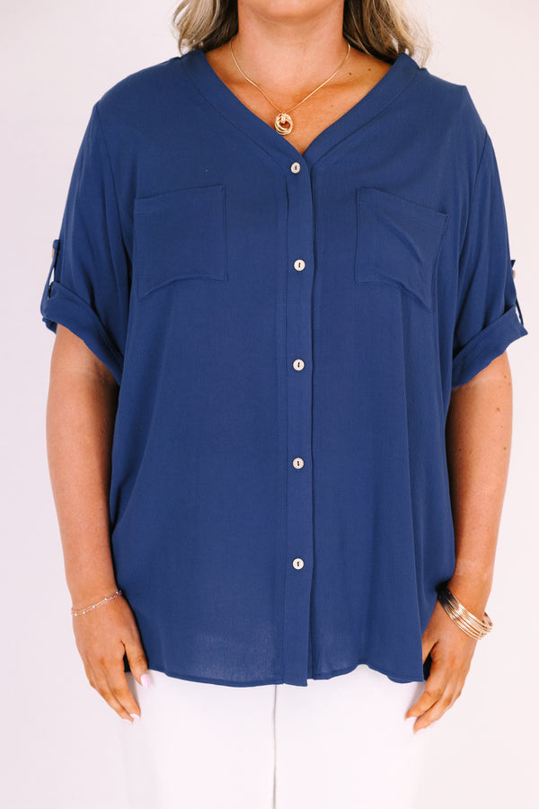 Plus Size navy short sleeve button-down blouse with a v-neckline and front chest pockets.