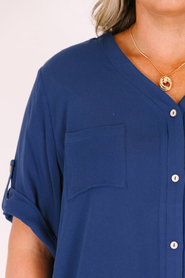 Plus Size navy short sleeve button-down blouse with a v-neckline and front chest pockets.