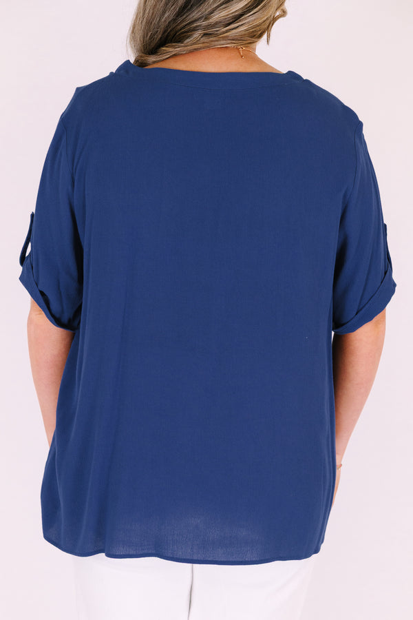 Plus Size navy short sleeve button-down blouse with a v-neckline and front chest pockets.