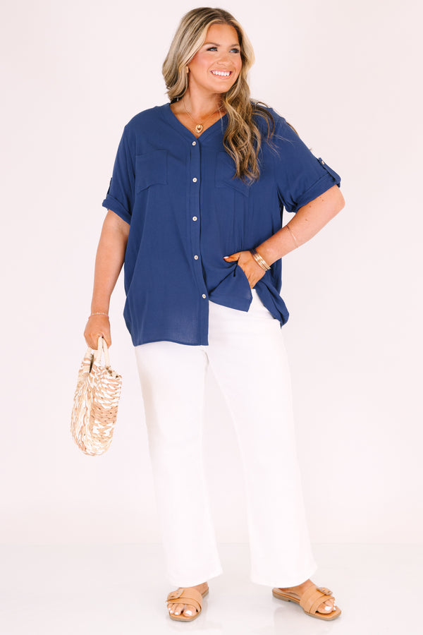 Plus Size navy short sleeve button-down blouse with a v-neckline and front chest pockets.