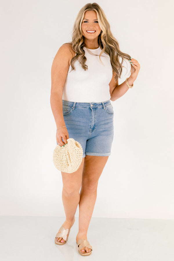 Chic Soul plus size clothing, light wash mid thigh length denim shorts with a rolled cuff hem