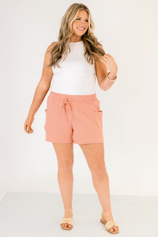 Chic Soul plus size clothing, rose colored lien shorts with pocket on the side of each short leg and a draw string waistband that has a bow that ties in the middle of the shorts 