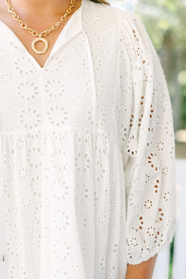 Chic Soul plus size clothing, white eyelet long sleeve babydoll dress with v neckline and tassels hanging from the collar
