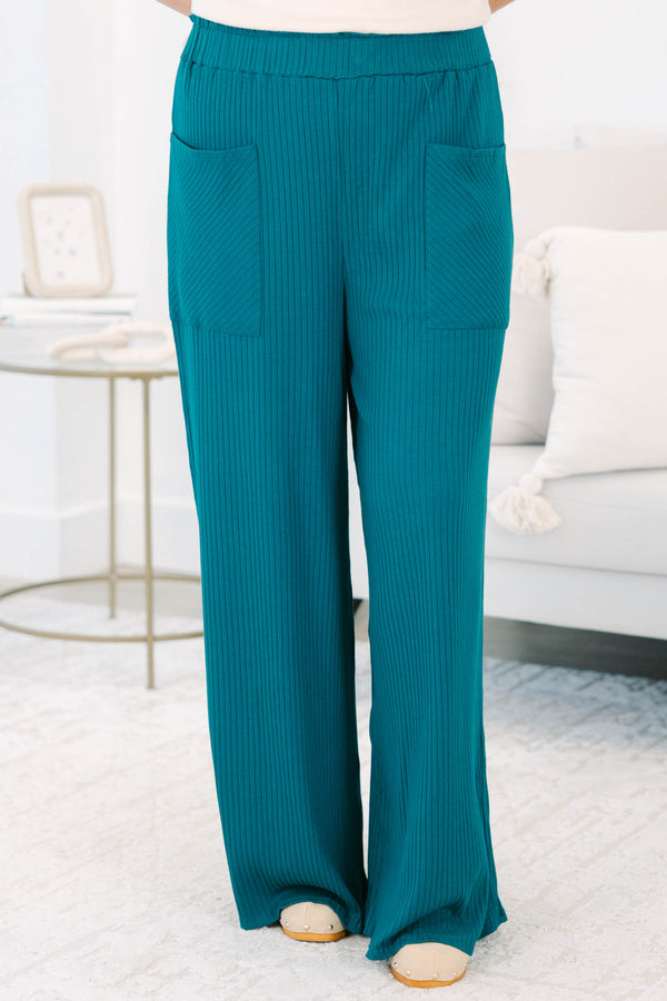 Plus size hunter green ribbed wide-leg pants with a stretchy elastic waist and front pockets.