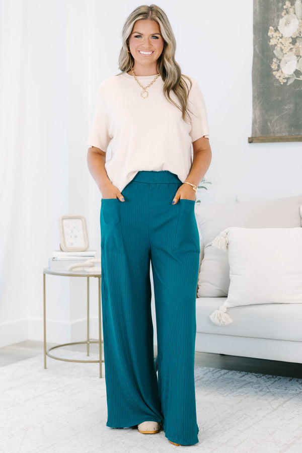 Plus size hunter green ribbed wide-leg pants with a stretchy elastic waist and front pockets.