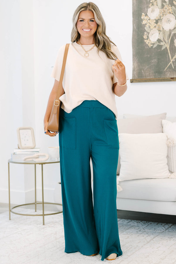 Plus size hunter green ribbed wide-leg pants with a stretchy elastic waist and front pockets.