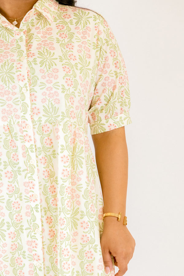Chic Soul plus size clothing,  pink floral button up maxi dress with short sleeves that have cuffs at each end as well as a collar and a pink and green floral pattern throughout
