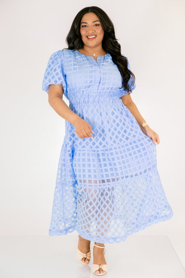 Chic Soul plus size clothing, pastel blue maxi dress with buttons going down to the chest and bubble sleeves as well as a sheer overlay going over the whole dress that has a plaid pattern 