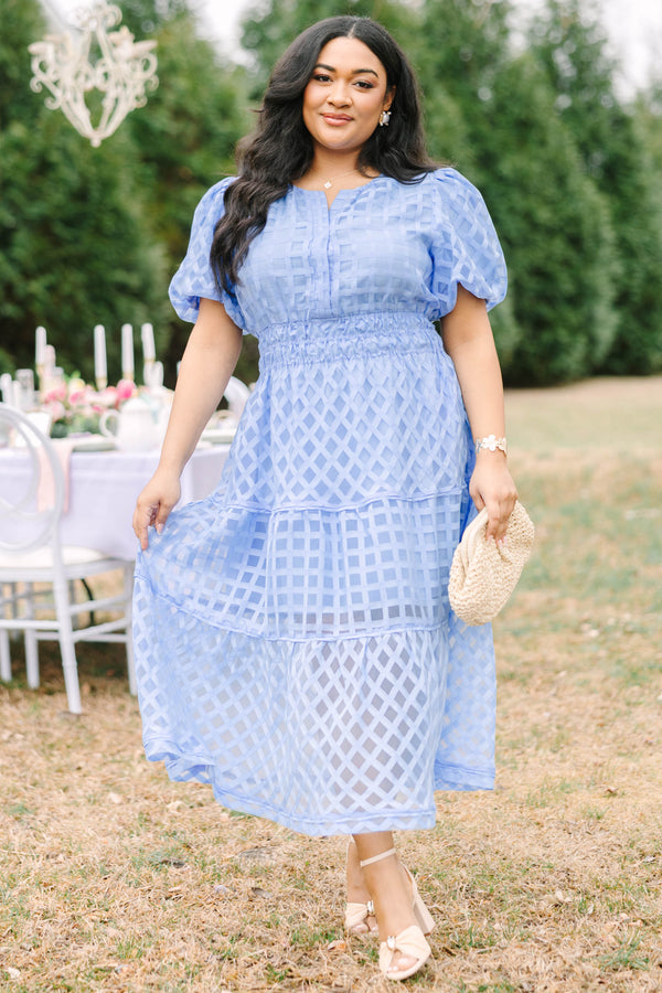 Chic Soul plus size clothing, pastel blue maxi dress with buttons going down to the chest and bubble sleeves as well as a sheer overlay going over the whole dress that has a plaid pattern 