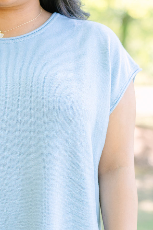 Plus Size light blue cap sleeve knit sweater with a round neckline and side slits.