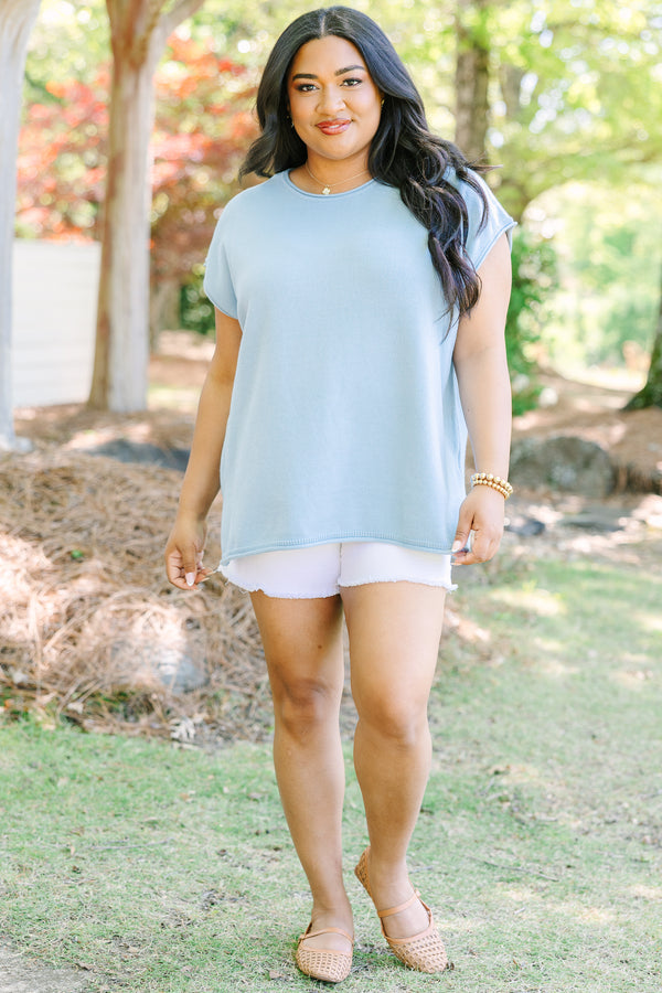 Plus Size light blue cap sleeve knit sweater with a round neckline and side slits.