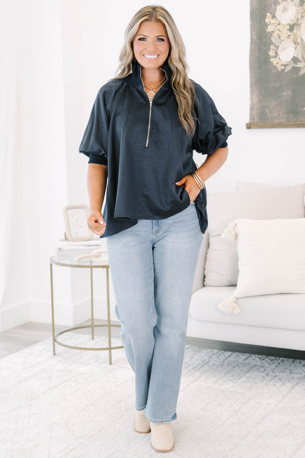 Plus size navy blue half-zip top with a flowy fit, short sleeves, and a gold zipper detail.