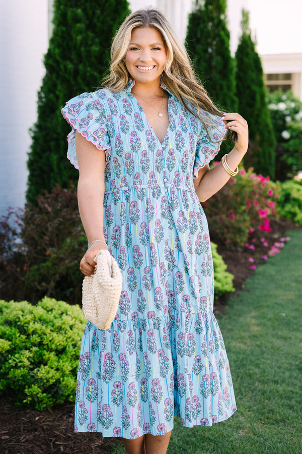 Chic Soul plus size clothing, blue midi dress with futter sleeves and a deep v-neckline as well as a pink floral block pattern throughout 
