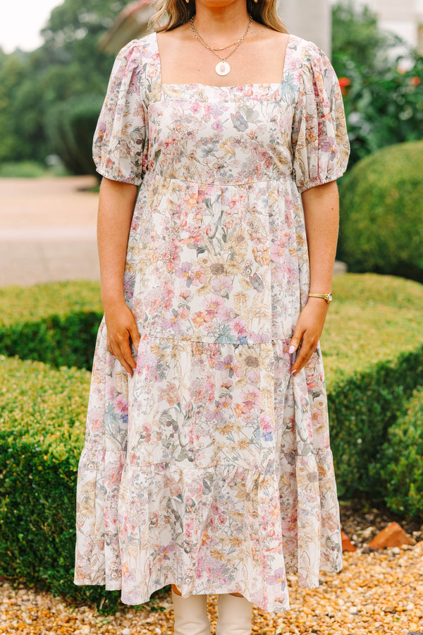 Plus Size pink floral tiered maxi dress with a square neckline and short puff sleeves.