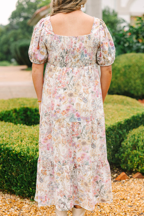 Plus Size pink floral tiered maxi dress with a square neckline and short puff sleeves.