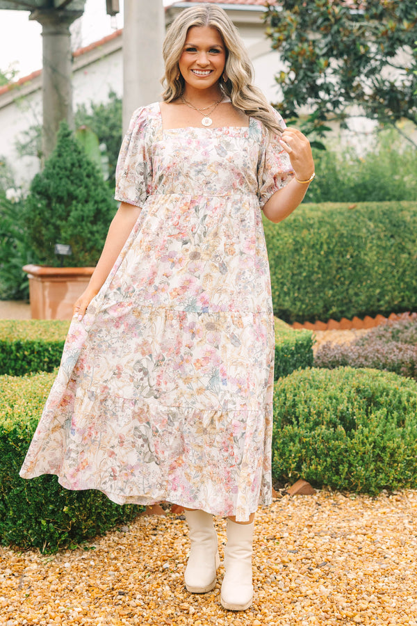 Plus Size pink floral tiered maxi dress with a square neckline and short puff sleeves.