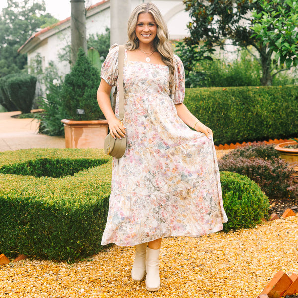 Plus Size pink floral tiered maxi dress with a square neckline and short puff sleeves.