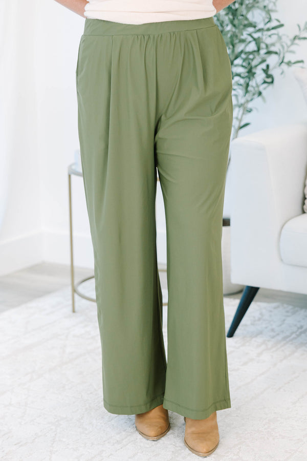 Plus size khaki green wide-leg pants with a flowy fit and stretchy, lightweight fabric.