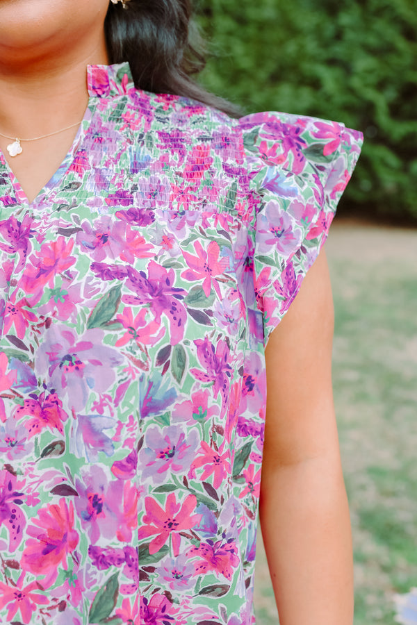 Plus Size purple floral top with smocking detail and flutter sleeves.