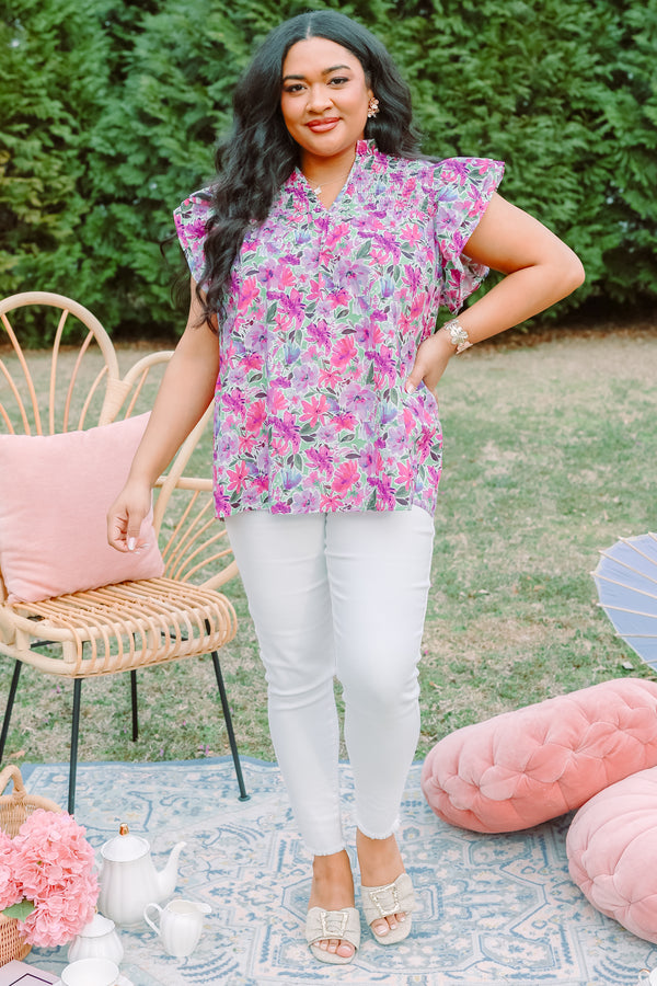 Plus Size purple floral top with smocking detail and flutter sleeves.