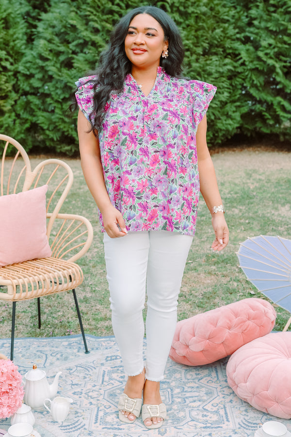 Plus Size purple floral top with smocking detail and flutter sleeves.