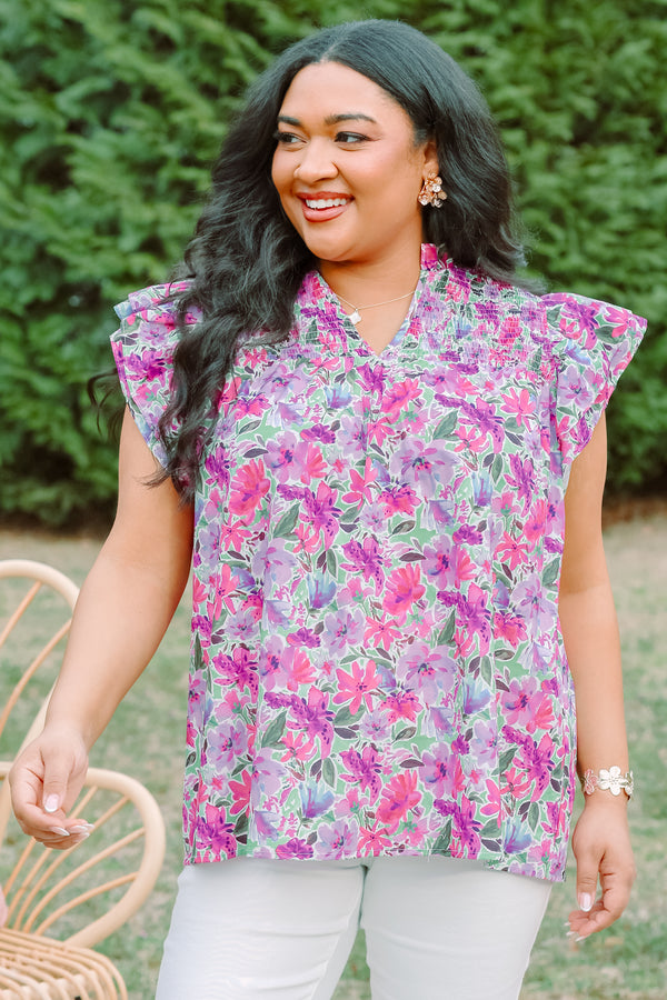Plus Size purple floral top with smocking detail and flutter sleeves.
