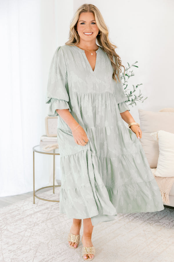 Chic Soul plus size clothing, sage tiered midi dress with half sleeves that have a ruffle detail at the end of each sleeve as well as a subtle floral pattern throughout and a slight v-neckline 
