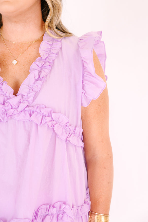 Chic Soul plus size clothing, purple top with flutter sleeves and ruffle detailing going along the v-neckline and under the chest as well as a ruffle stripe going across the bottom of the top 
