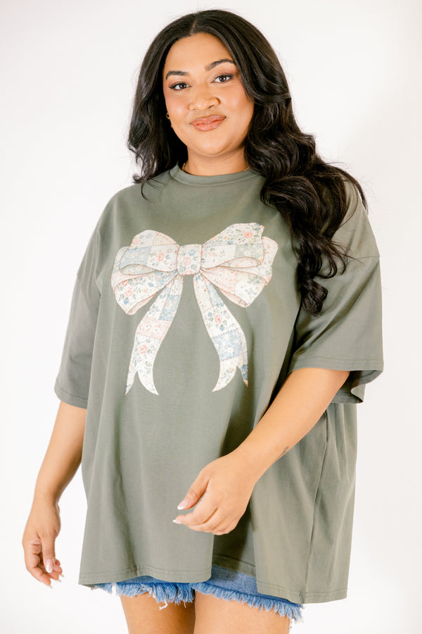 Chic Soul plus size clothing, dark olive green short sleeve boyfriend tee with patchwork patterned bow in the middle