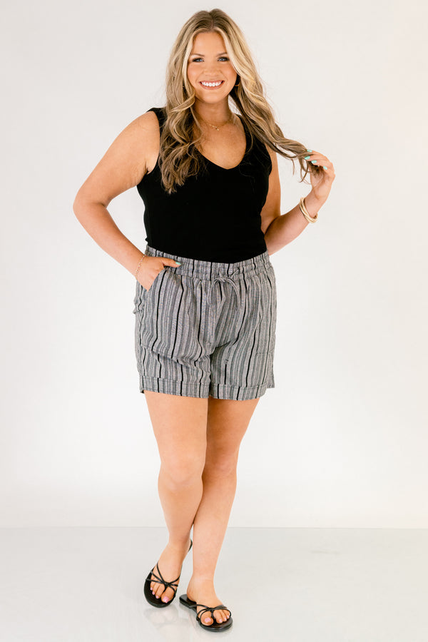 Chic Soul plus size clothing, gray striped shorts with pockets on the front of the shirts ad a draw string waistband that has a bow that ties in the center of the shorts 