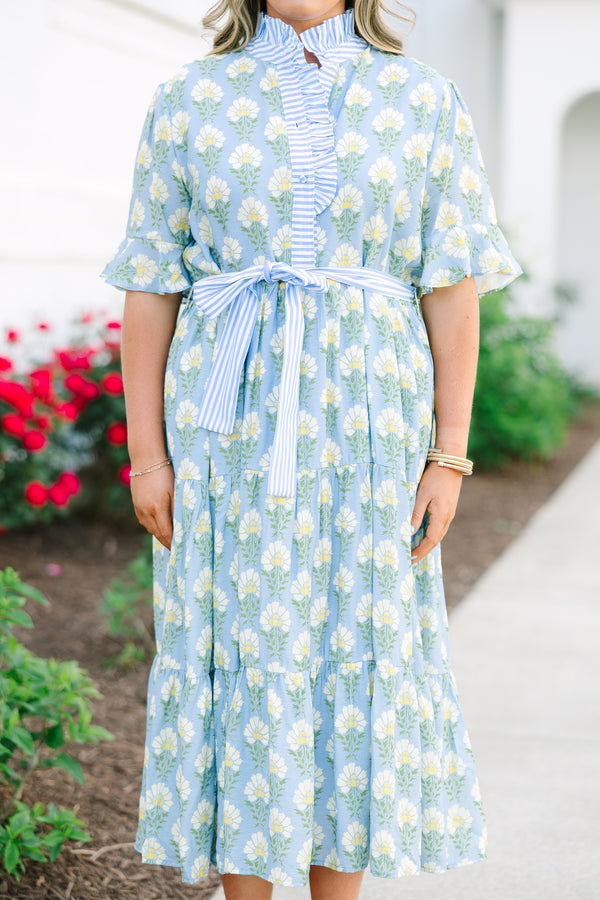 Plus Size blue floral midi dress with a ruffle collar, striped waist tie, and tiered skirt.