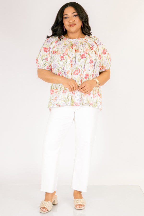 Chic Soul plus size clothing, white top with short bubble sleeves that has a green floral pattern throughout 