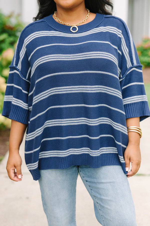 Plus size navy and white striped sweater with a flowy fit, crew neck, and elbow-length sleeves.