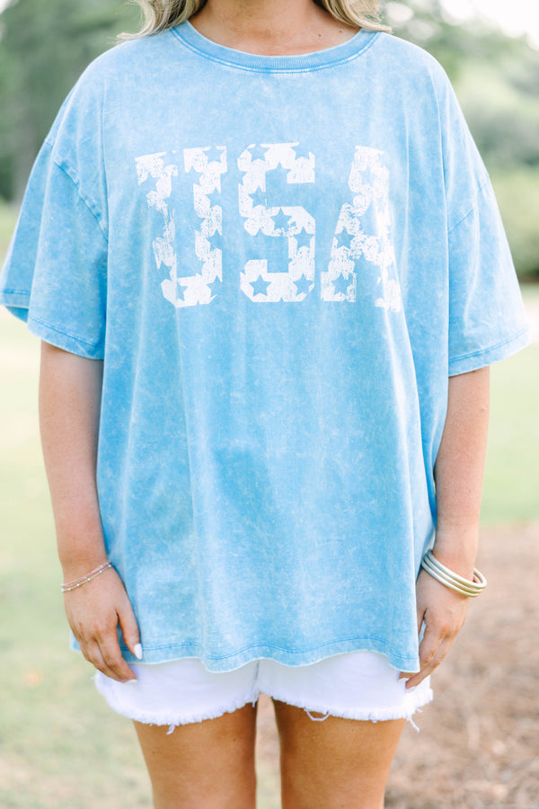Plus Size vintage USA acid wash relaxed tee in deep sky blue with white star-patterned lettering.