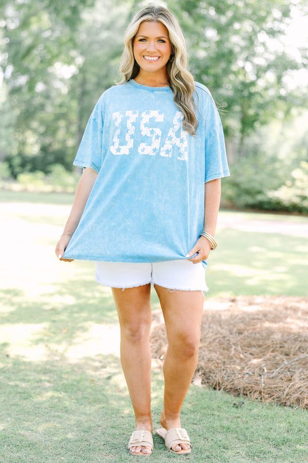 Plus Size vintage USA acid wash relaxed tee in deep sky blue with white star-patterned lettering.