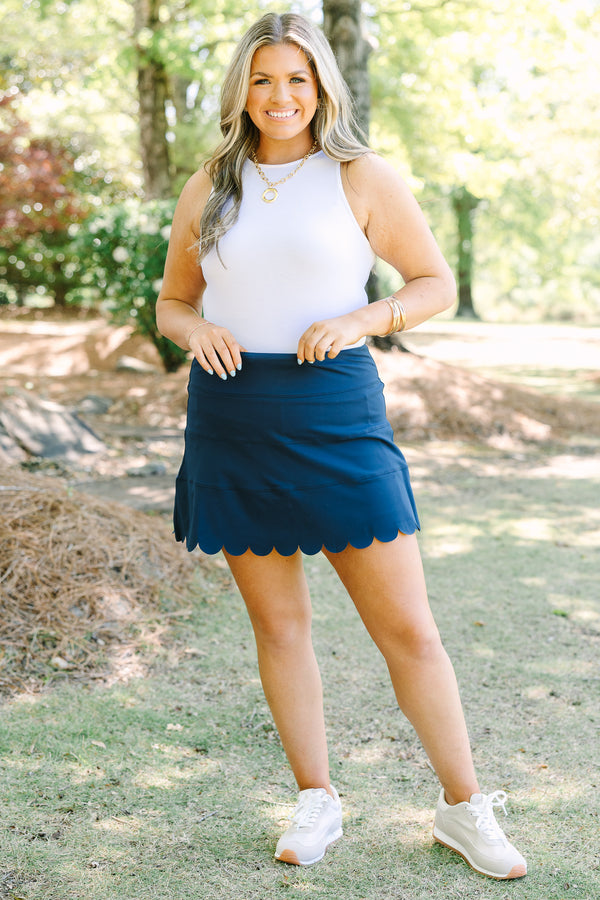 Plus Size navy blue athleisure skort with a scalloped hemline and comfortable pull-on design.