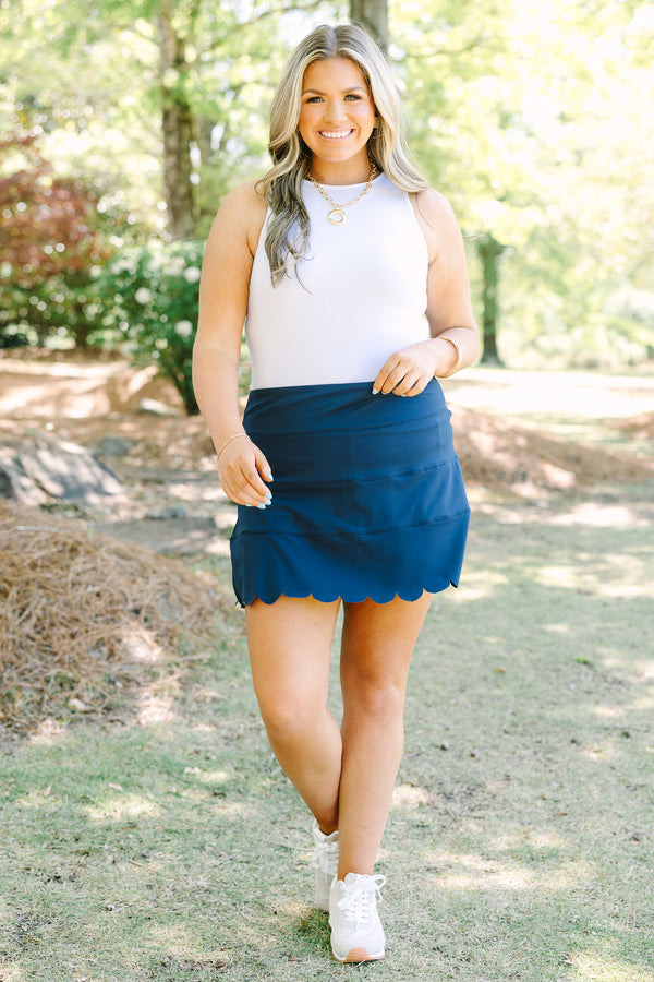 Plus Size navy blue athleisure skort with a scalloped hemline and comfortable pull-on design.